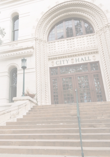 Outside front steps of city hall building.